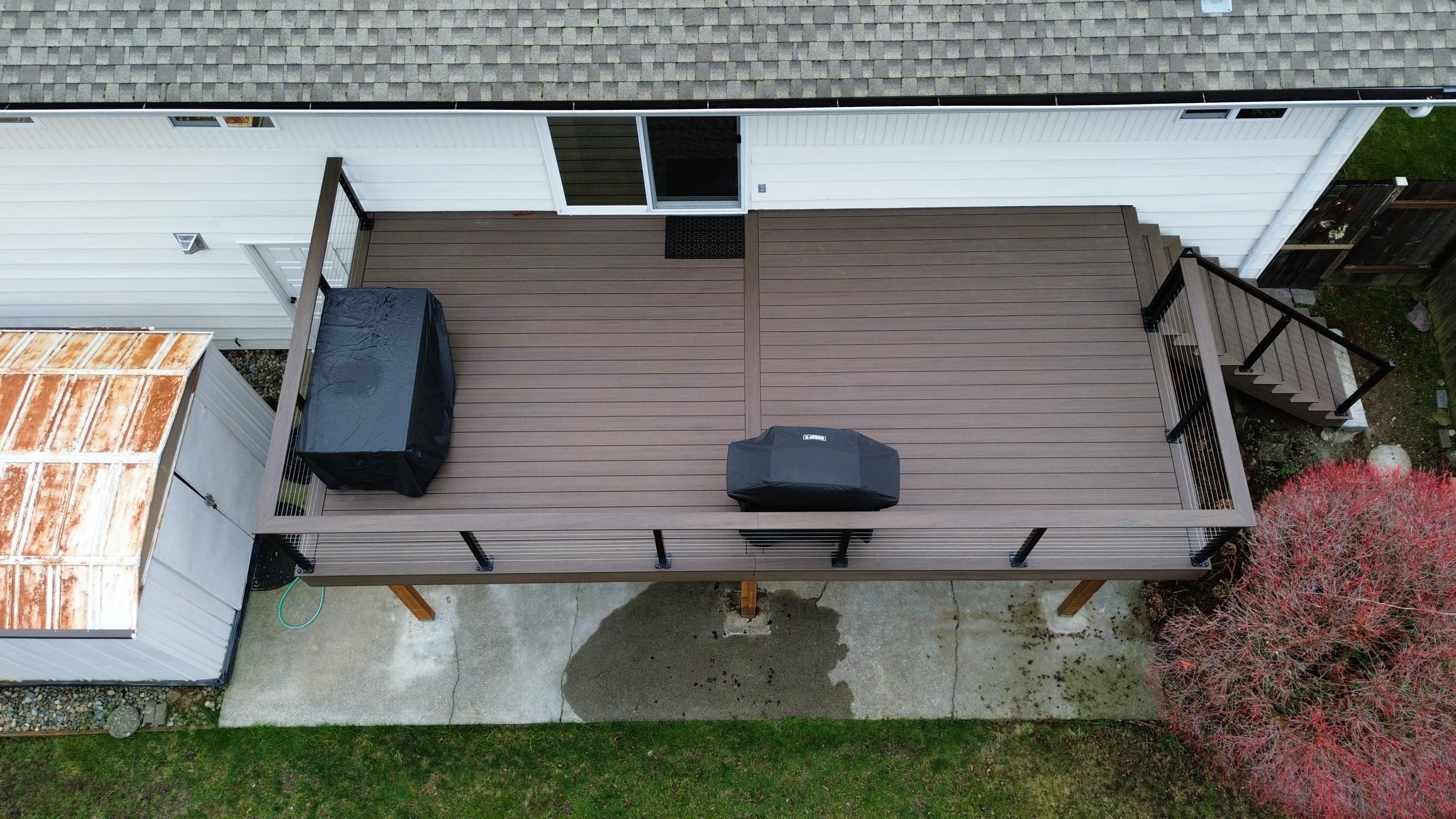 TimberTech Dark Cocoa deck with black aluminum rails and stainless steel cable
